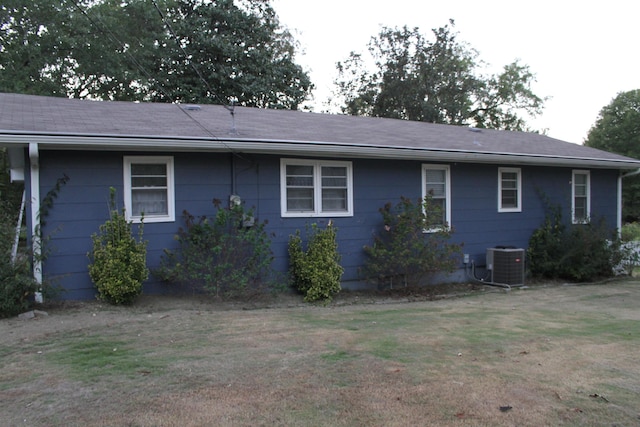 back of house featuring central AC