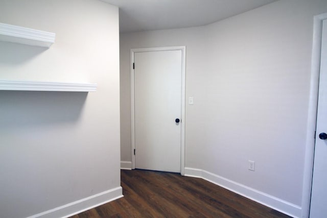 unfurnished room with dark hardwood / wood-style floors