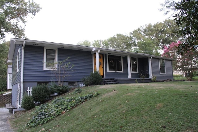 ranch-style house featuring a front lawn