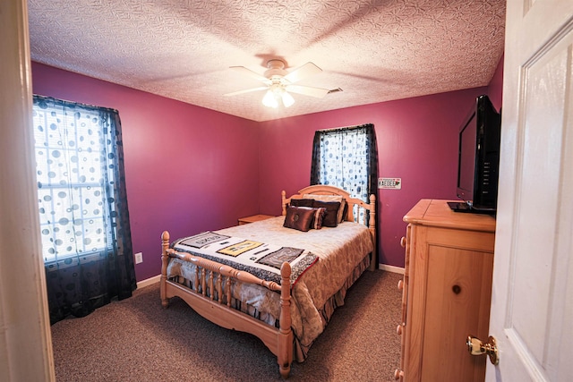 bedroom featuring carpet, a textured ceiling, and ceiling fan