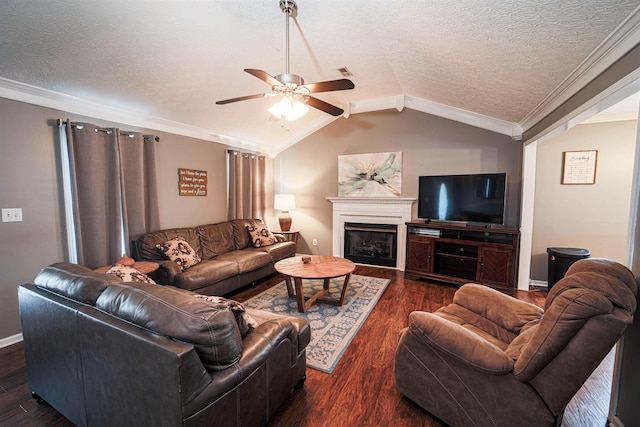 living room with lofted ceiling, dark hardwood / wood-style floors, a textured ceiling, and ornamental molding