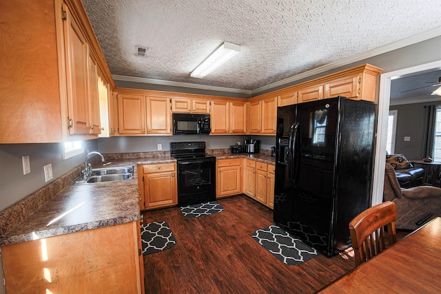 kitchen with ornamental molding, a textured ceiling, sink, black appliances, and dark hardwood / wood-style floors