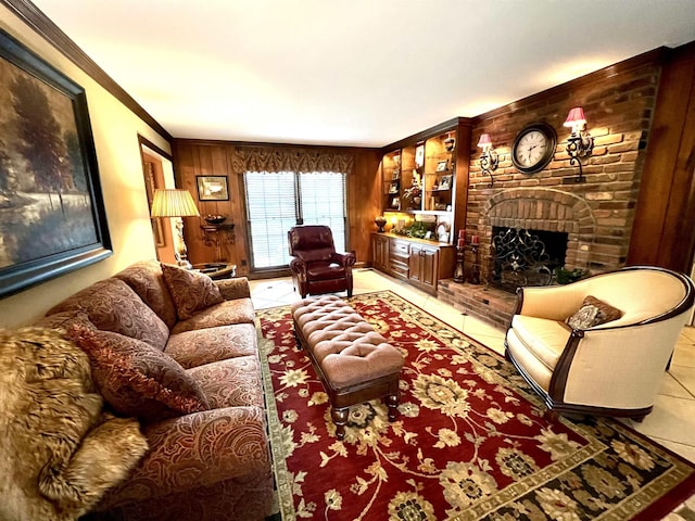 living room with a brick fireplace, light tile patterned floors, ornamental molding, and wood walls