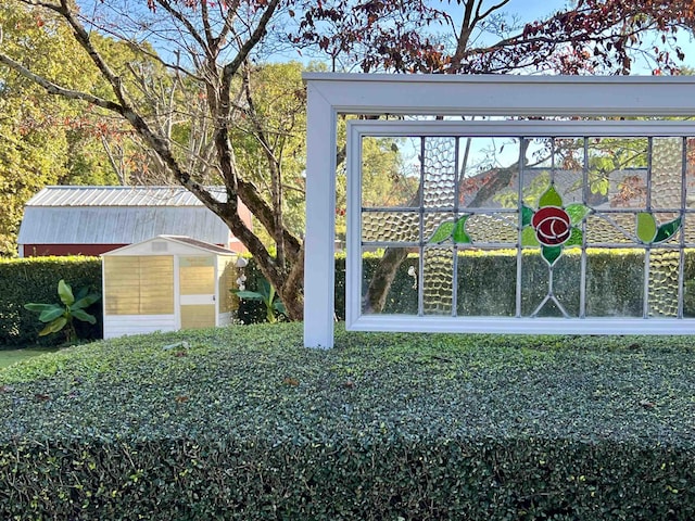 exterior space featuring a shed and an outbuilding