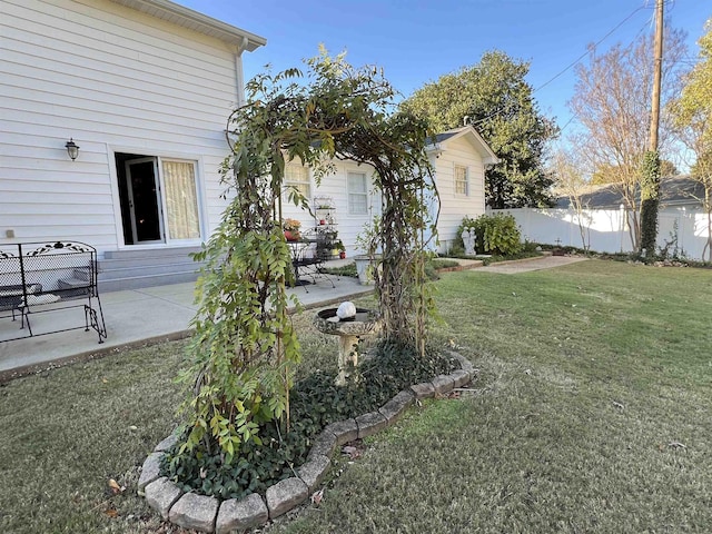 view of yard with a patio and fence