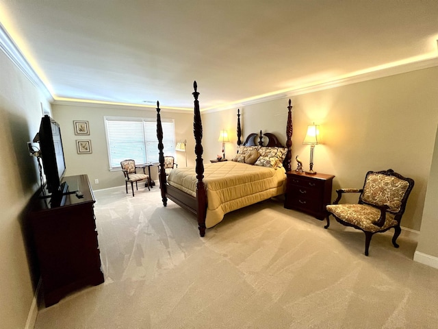 bedroom featuring light carpet, crown molding, and baseboards