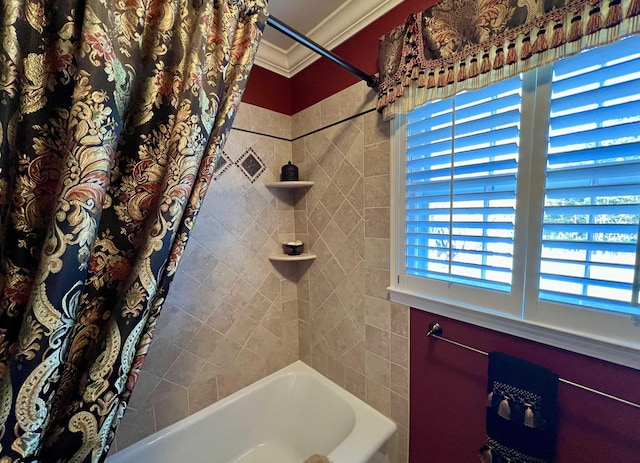 bathroom with ornamental molding and shower / tub combo