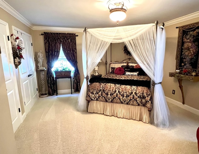 carpeted bedroom with baseboards and ornamental molding