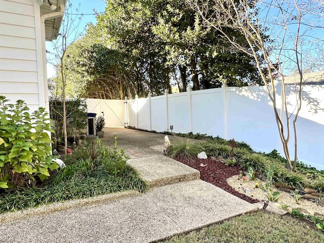 view of yard with a gate and fence