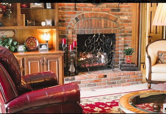 living area featuring a fireplace and tile patterned flooring