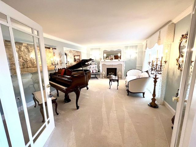 living area with carpet, a premium fireplace, baseboards, and crown molding