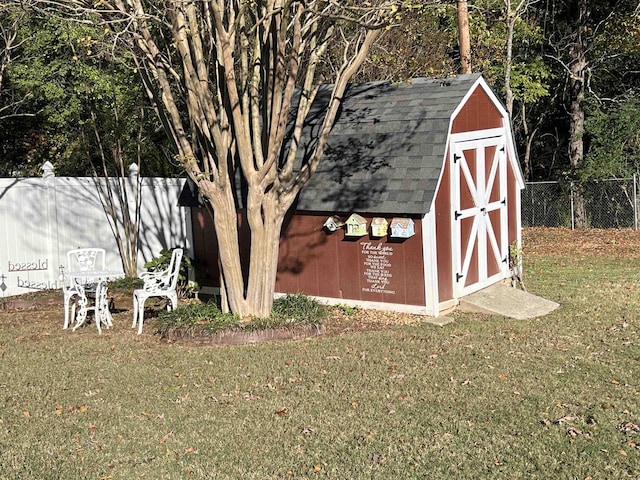 view of shed featuring fence