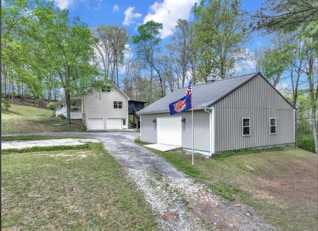 exterior space featuring a garage and a front lawn