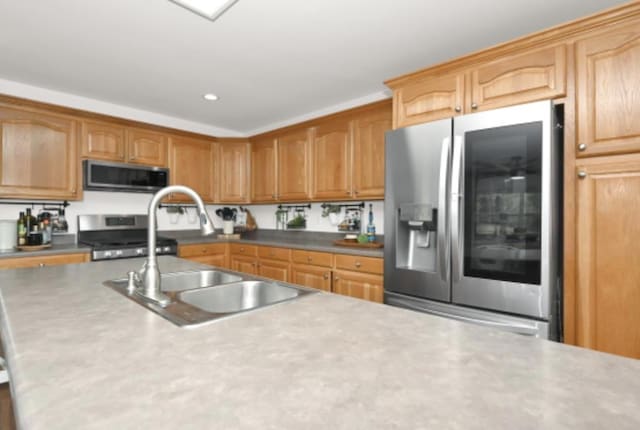 kitchen with appliances with stainless steel finishes and sink