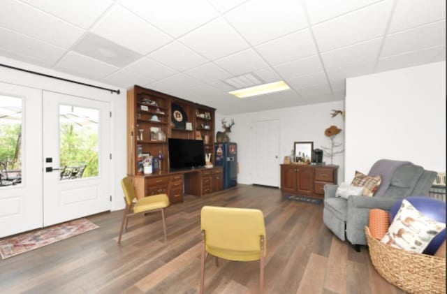 living room featuring dark hardwood / wood-style flooring and french doors