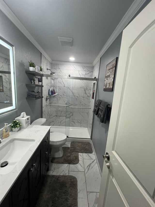  - bathroom featuring crown molding, toilet, vanity, marble finish floors, and a marble finish shower