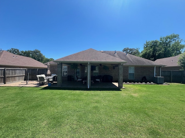  - rear view of property featuring a patio, ceiling fan, central AC unit, and brick siding