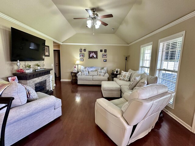  - living area with ceiling fan, dark wood-type flooring, baseboards, lofted ceiling, and a stone fireplace