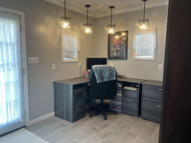  - office area featuring healthy amount of natural light, crown molding, wood tiled floors, and baseboards
