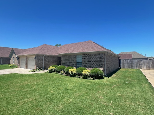 - ranch-style home with brick siding, a garage, and driveway