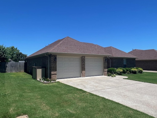  - view of front of home with a garage, driveway, and brick siding