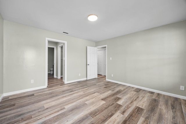 unfurnished bedroom with light hardwood / wood-style floors