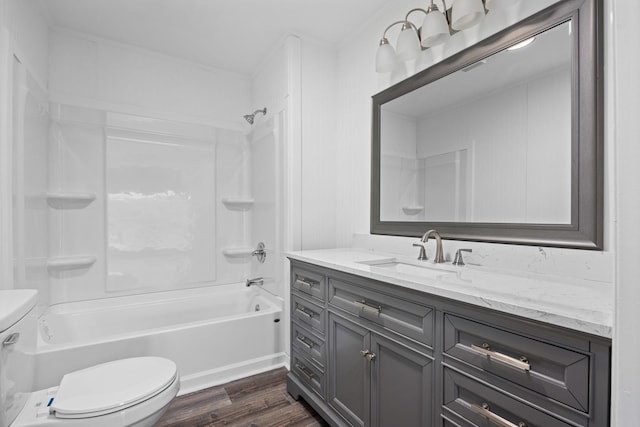 full bathroom featuring hardwood / wood-style flooring, vanity, toilet, and shower / bathing tub combination