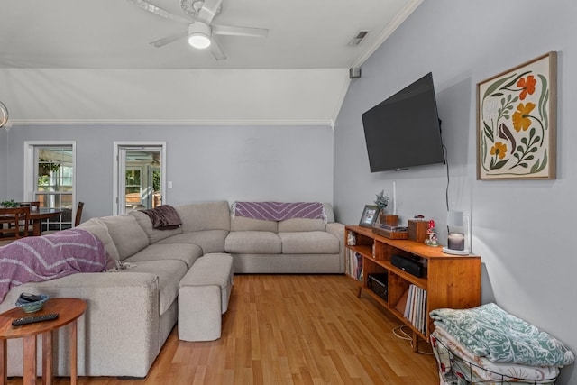  - living area with ornamental molding, a ceiling fan, light wood finished floors, and lofted ceiling