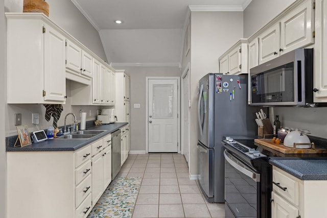  - kitchen featuring appliances with stainless steel finishes, a sink, dark countertops, ornamental molding, and baseboards