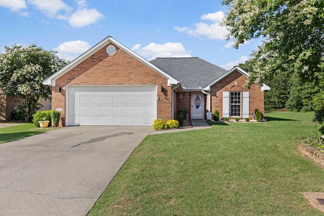 - traditional-style house with brick siding, driveway, a front lawn, a garage, and roof with shingles