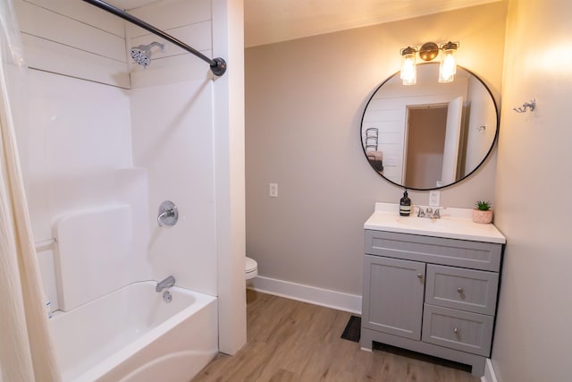  - bathroom featuring vanity, shower / bathtub combination, and wood finished floors
