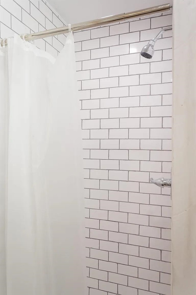  - bathroom view of a tile shower