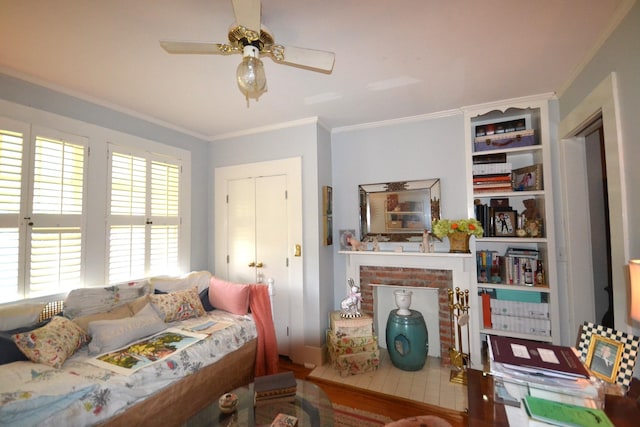 bedroom featuring ceiling fan, ornamental molding, a fireplace, and multiple windows