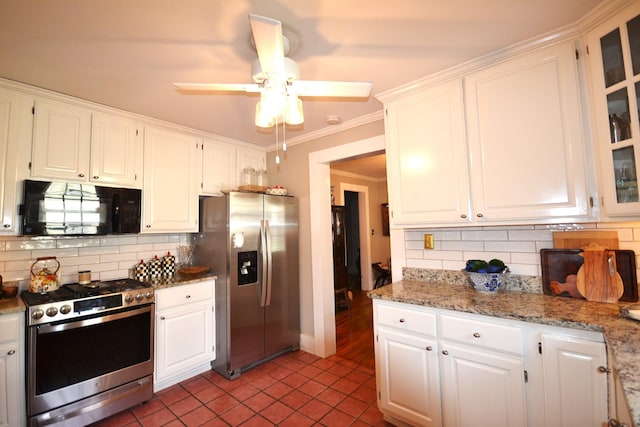 kitchen featuring white cabinetry, backsplash, and appliances with stainless steel finishes