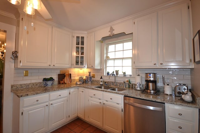 kitchen featuring white cabinetry, sink, tasteful backsplash, and dishwasher