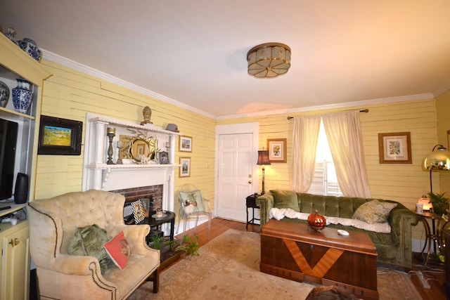 living room with crown molding and wooden walls