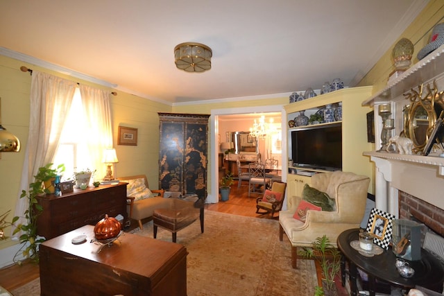 living room with crown molding, a fireplace, and light wood-type flooring