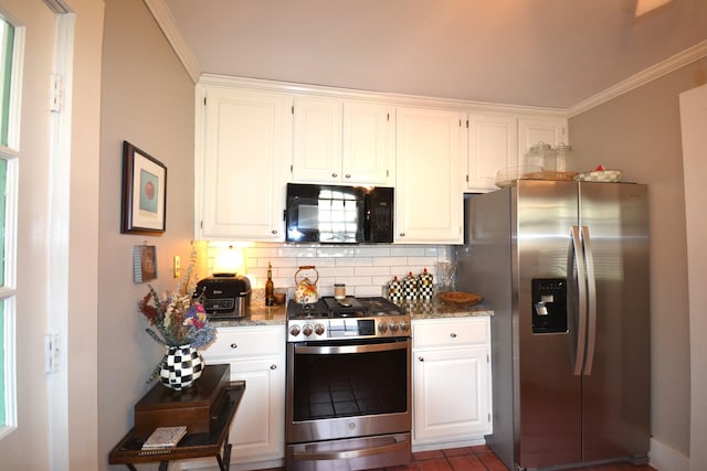 kitchen with white cabinetry, decorative backsplash, and appliances with stainless steel finishes