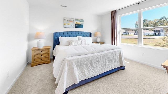  - carpeted bedroom with baseboards