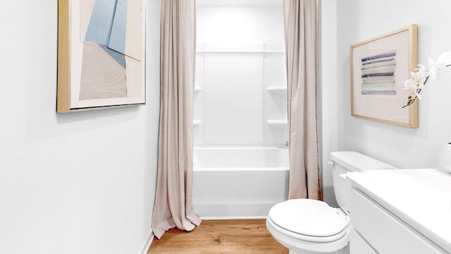  - full bathroom featuring toilet, vanity, shower / bathtub combination with curtain, and wood finished floors