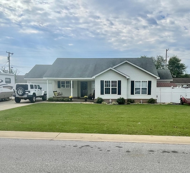 ranch-style house featuring a porch and a front yard