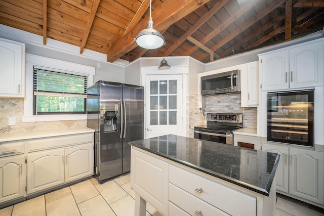 kitchen featuring backsplash, lofted ceiling with beams, appliances with stainless steel finishes, white cabinetry, and beverage cooler