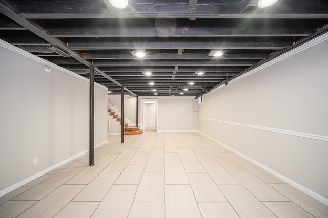 basement featuring crown molding