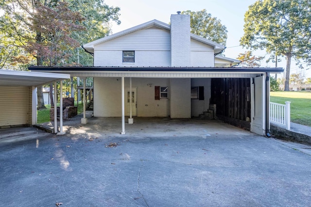 exterior space with a carport