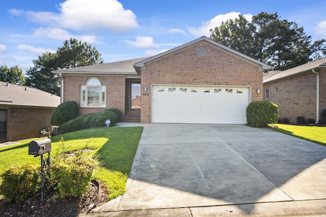 ranch-style home featuring a front lawn and a garage