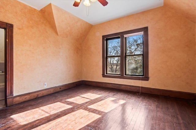 bonus room with hardwood / wood-style flooring and ceiling fan