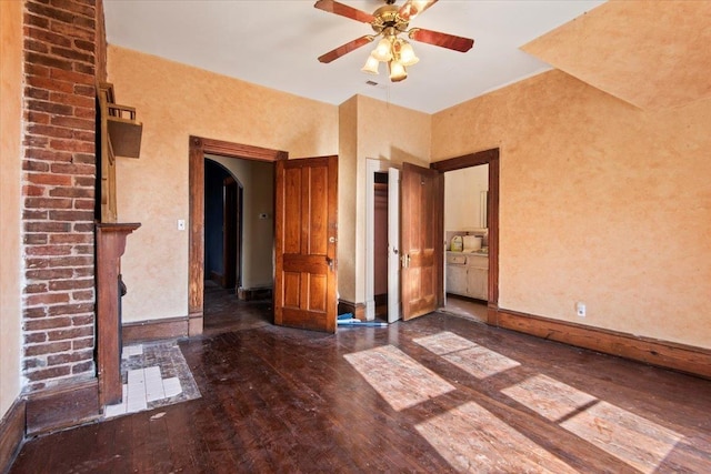 unfurnished bedroom featuring dark hardwood / wood-style flooring and ceiling fan