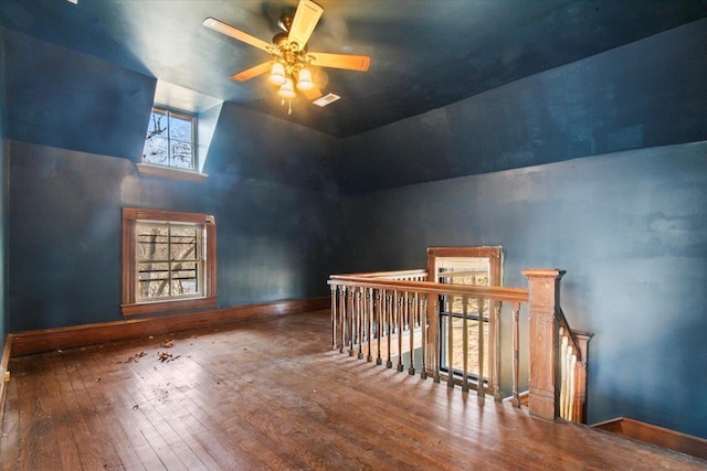 additional living space with ceiling fan, high vaulted ceiling, and hardwood / wood-style floors