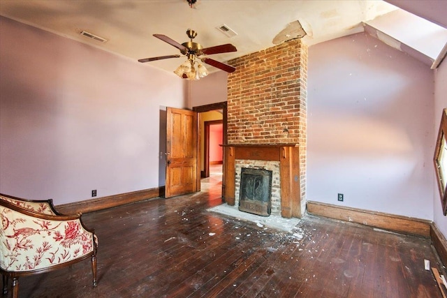 unfurnished living room with dark hardwood / wood-style flooring, a fireplace, and ceiling fan