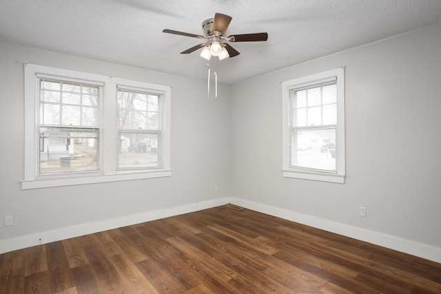 unfurnished room with wood-type flooring, ceiling fan, and a textured ceiling